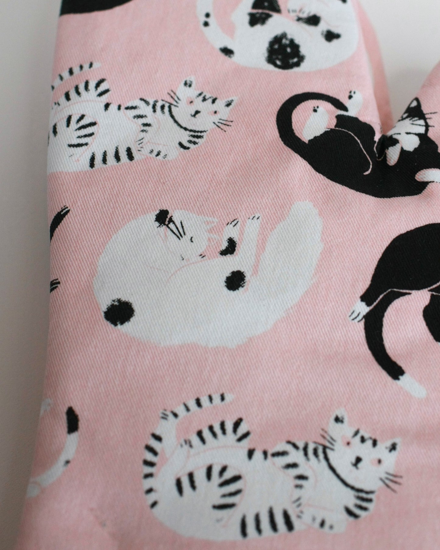 Pink oven mitts with black and white cats - 2 mitts