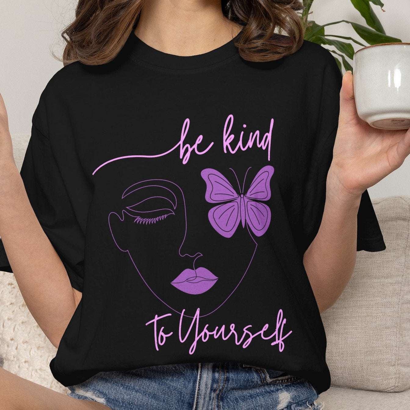 black t shirt with a butterfly design and a "be kind to yourself" message